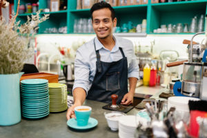 Barista Serving Cappuccino in Coffee Shop