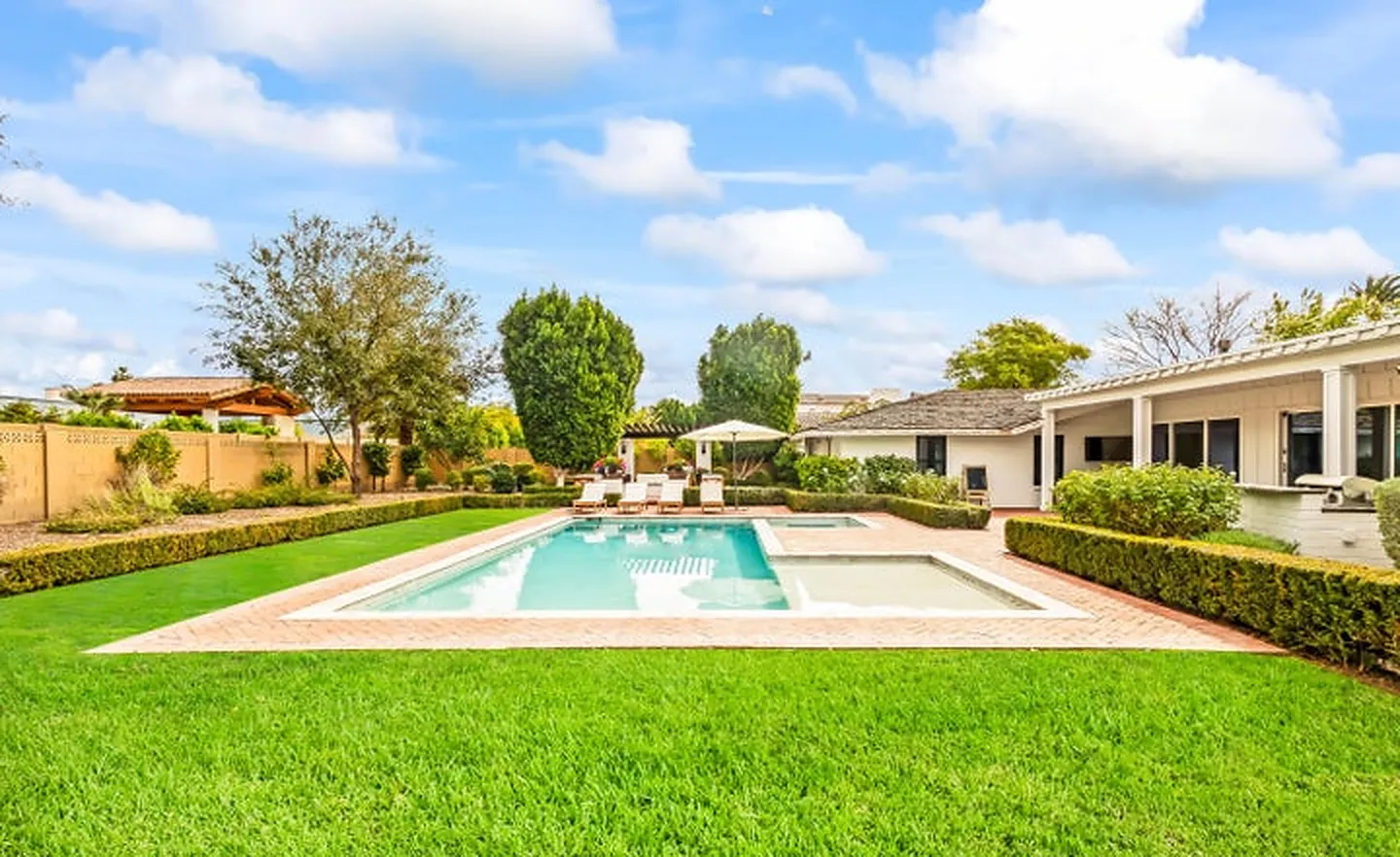 Ranch home with a pool on an irrigated lot in Arcadia, Phoenix