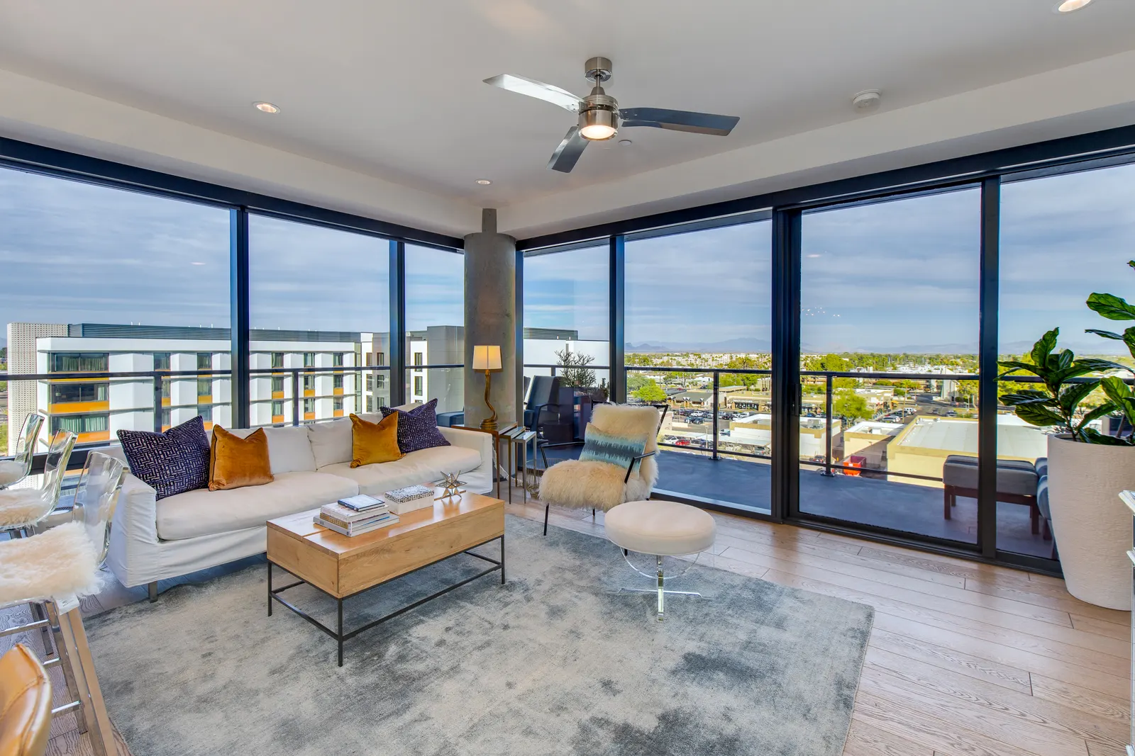 Living room with floor to ceiling windows at Envy Residences in Old Town Scottsdale